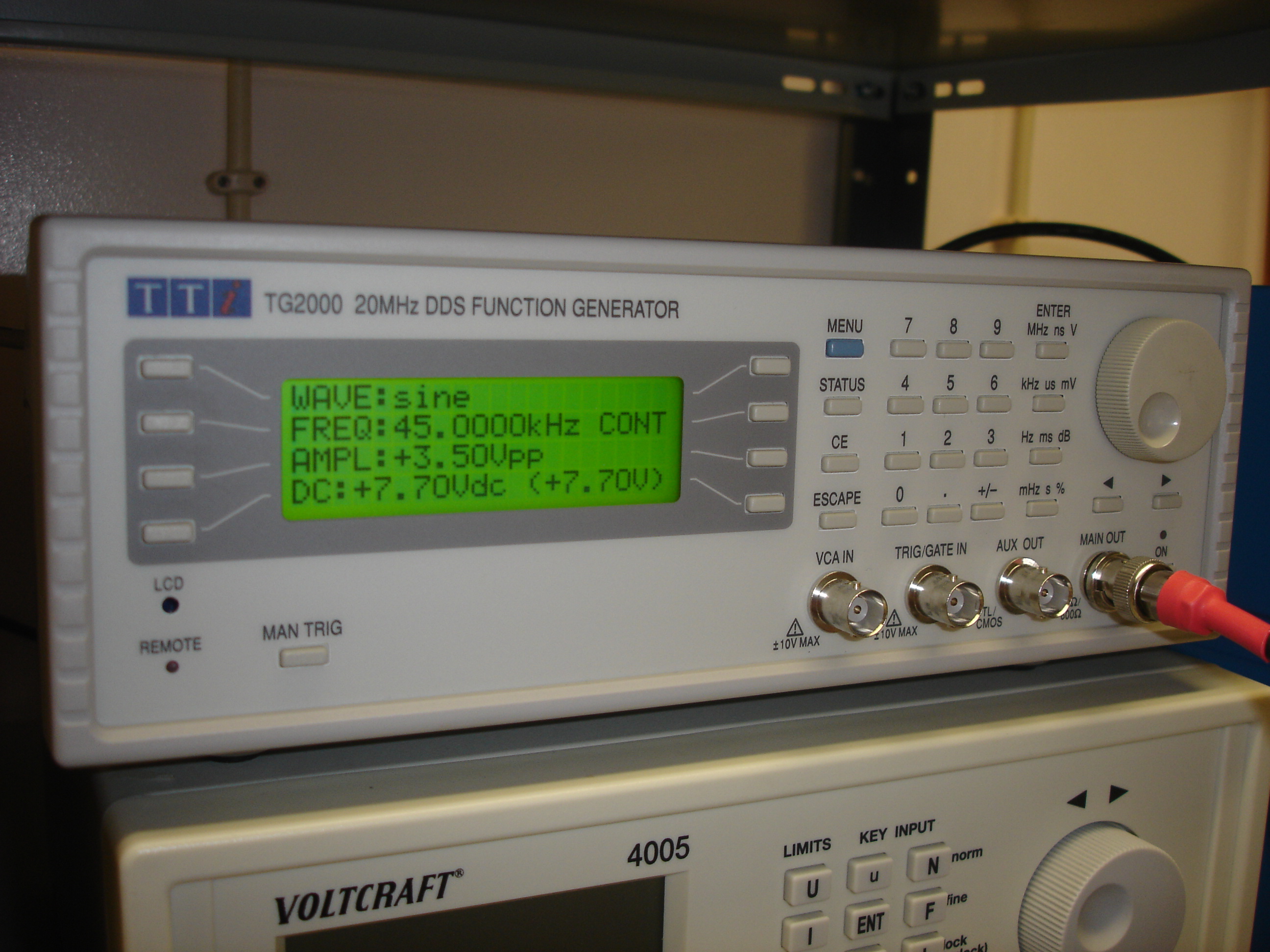 A bench function generator, a real instrument used to produce controlled electrical waveforms including pulses.
